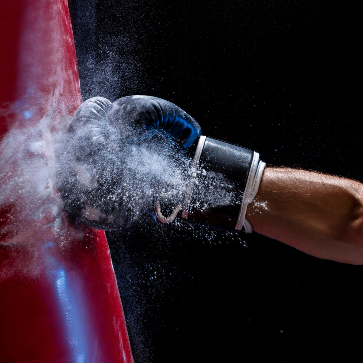 Punching a bag with determination symbolizes productivity and balance with Full Focus tools for the Double Win.